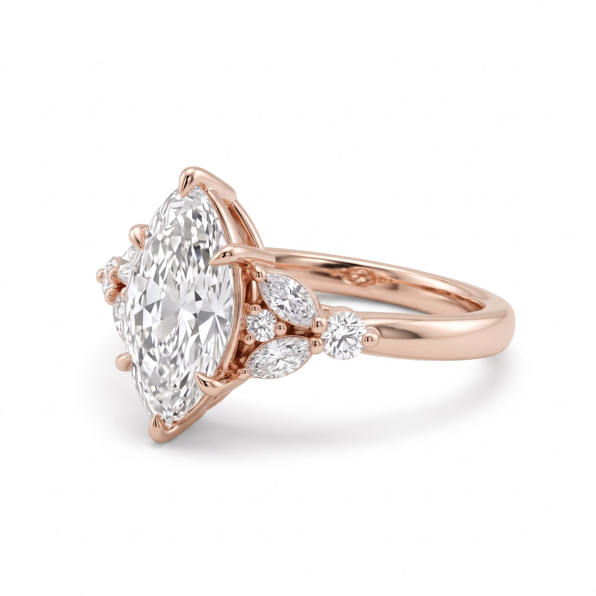 Marquise lab grown diamond engagement ring with marquise and round diamond cluster side stones