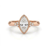 Bezel set marquise lab grown diamond engagement ring with round cluster side stones in white gold