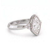 Bezel set marquise lab grown diamond engagement ring with round cluster side stones in white gold