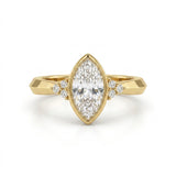Bezel set marquise lab grown diamond engagement ring with round cluster side stones in white gold