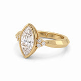 Bezel set marquise lab grown diamond engagement ring with round cluster side stones in white gold