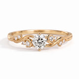 Vintage three-stone round lab-grown diamond ring with leaf-design yellow-gold band