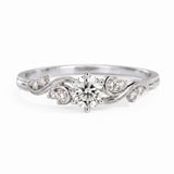 Vintage three-stone round lab-grown diamond ring with leaf-design yellow-gold band