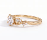 Vintage three-stone round lab-grown diamond ring with leaf-design yellow-gold band