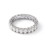 Oval cut moissanite full eternity wedding band in white gold with prong set stones