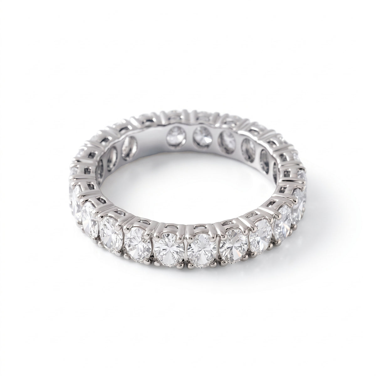 Oval cut moissanite full eternity wedding band in white gold with prong set stones
