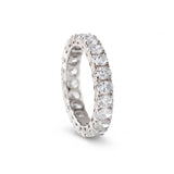Oval cut moissanite full eternity wedding band in white gold with prong set stones