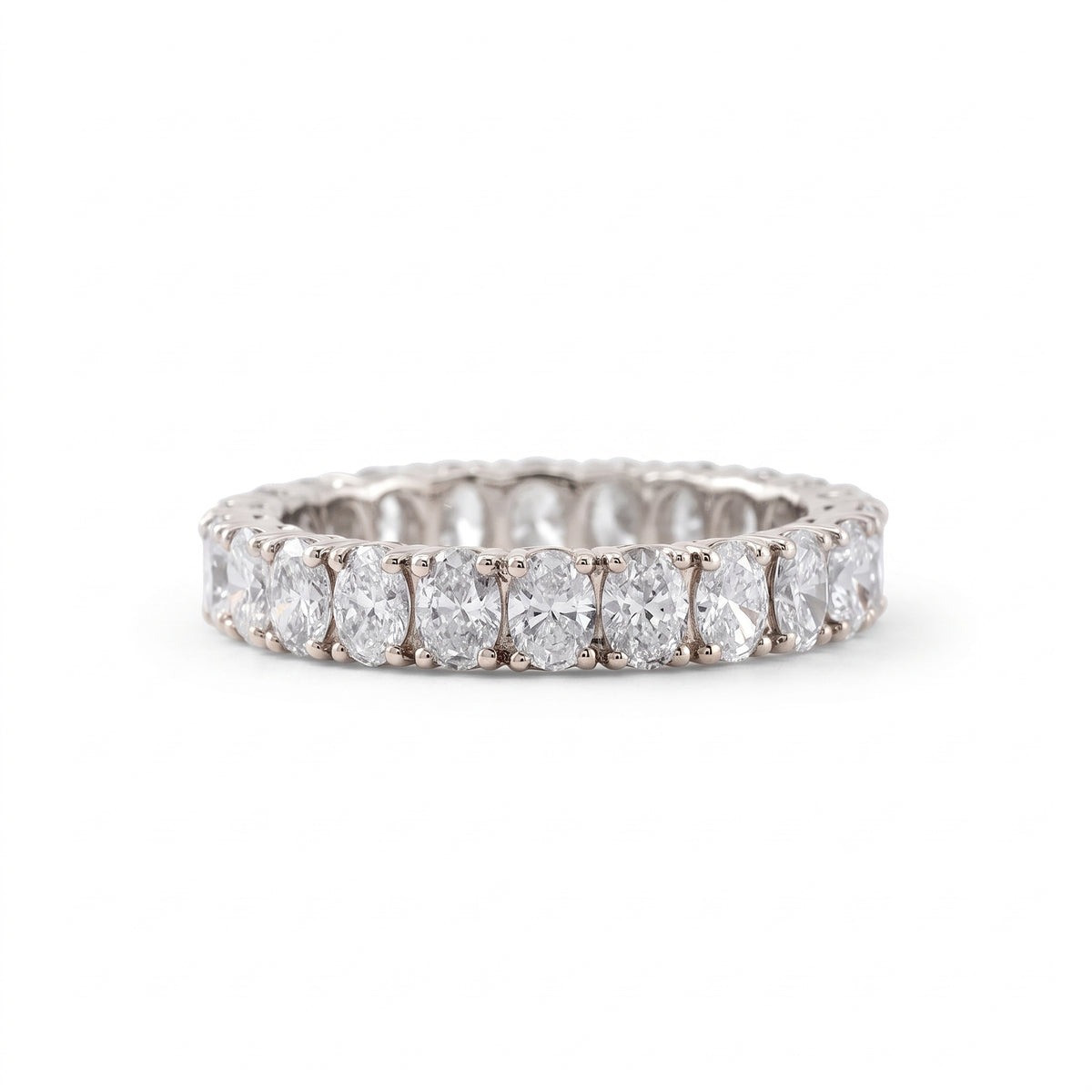 Oval cut moissanite full eternity wedding band in white gold with prong set stones