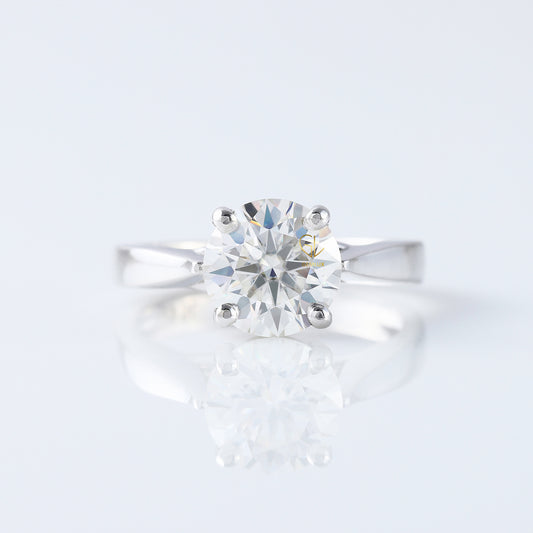 Pinch Style Round Moissanite Solitaire Engagement Ring