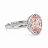 Fancy pink oval lab-grown diamond partial-bezel engagement ring with pavé accents