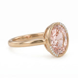 Fancy pink oval lab-grown diamond partial-bezel engagement ring with pavé accents