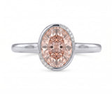 Fancy pink oval lab-grown diamond partial-bezel engagement ring with pavé accents