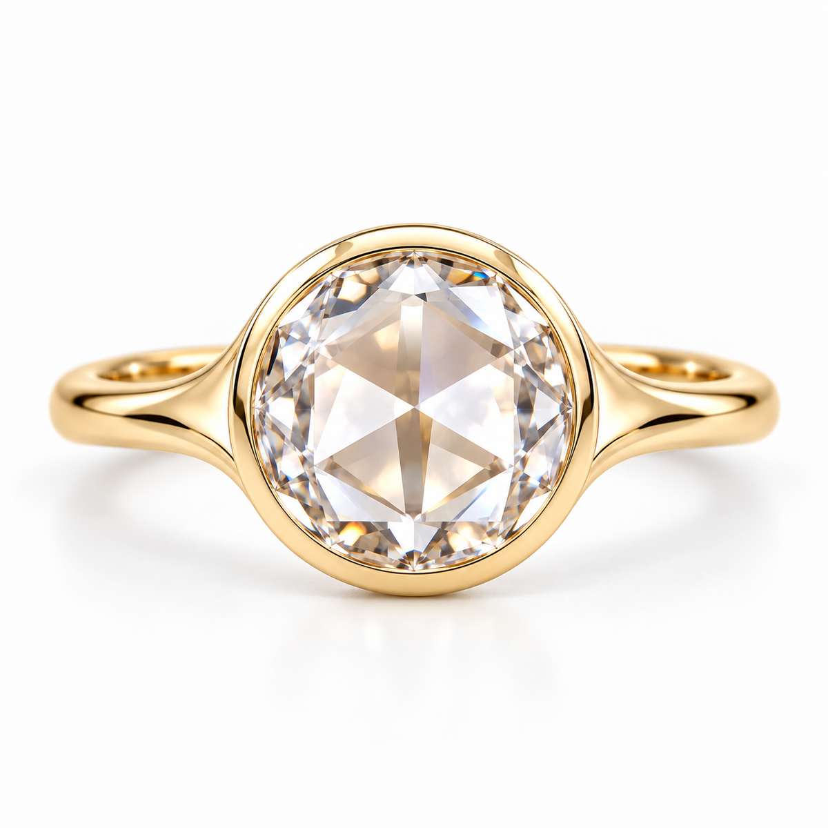 Round rose-cut lab-grown diamond solitaire ring with a smooth bezel setting and sculpted polished white-metal band