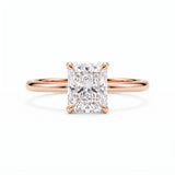 Elongated radiant-cut lab-grown diamond solitaire engagement ring with four prongs and a polished yellow-gold band.