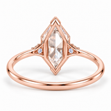 Marquise-cut lab-grown diamond engagement ring with two round side diamonds, V-shaped tip protection and a polished white-metal band