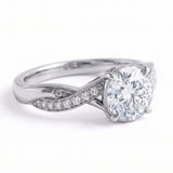 Round lab grown diamond engagement ring with twisted pavé and milgrain band