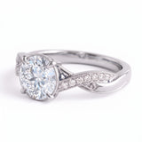 Round lab grown diamond engagement ring with twisted pavé and milgrain band
