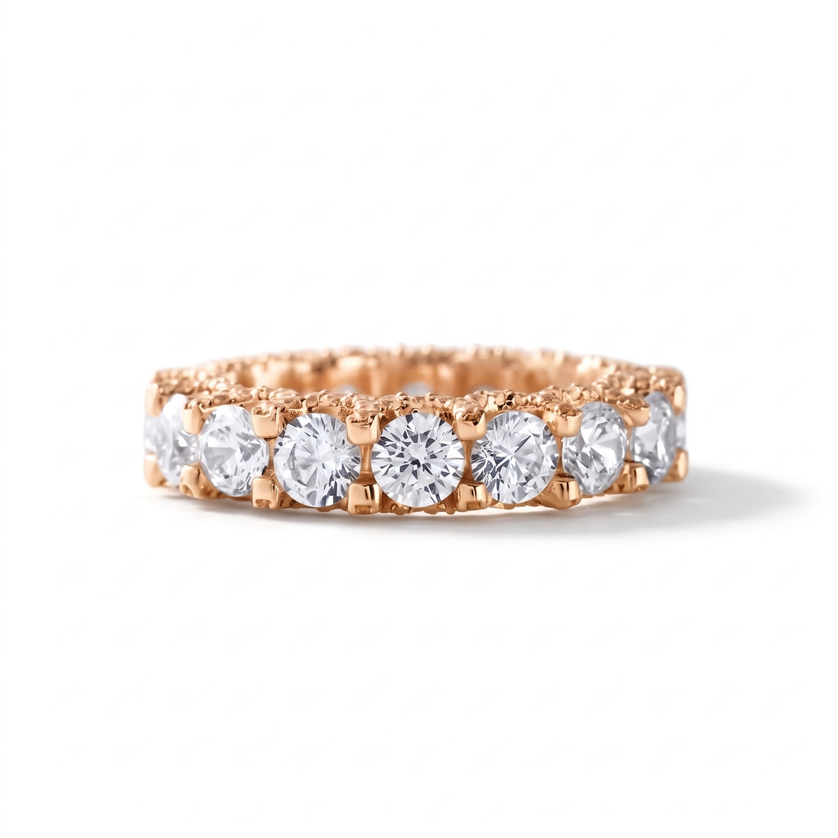 Round cut moissanite full eternity wedding band in white gold with prong set stones