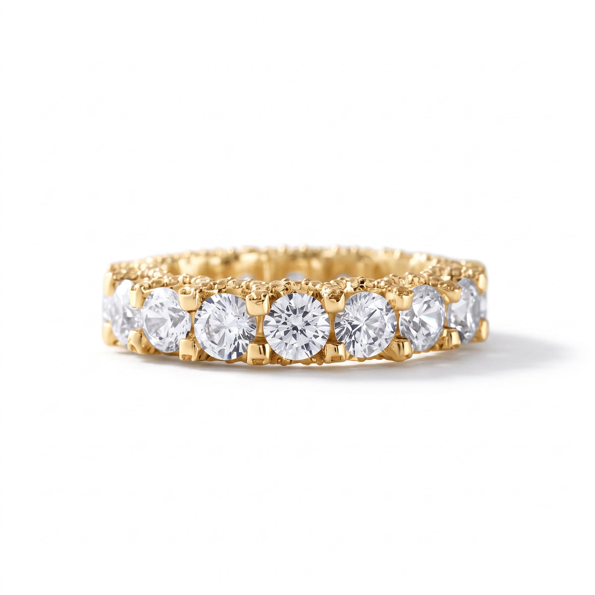 Round cut moissanite full eternity wedding band in white gold with prong set stones