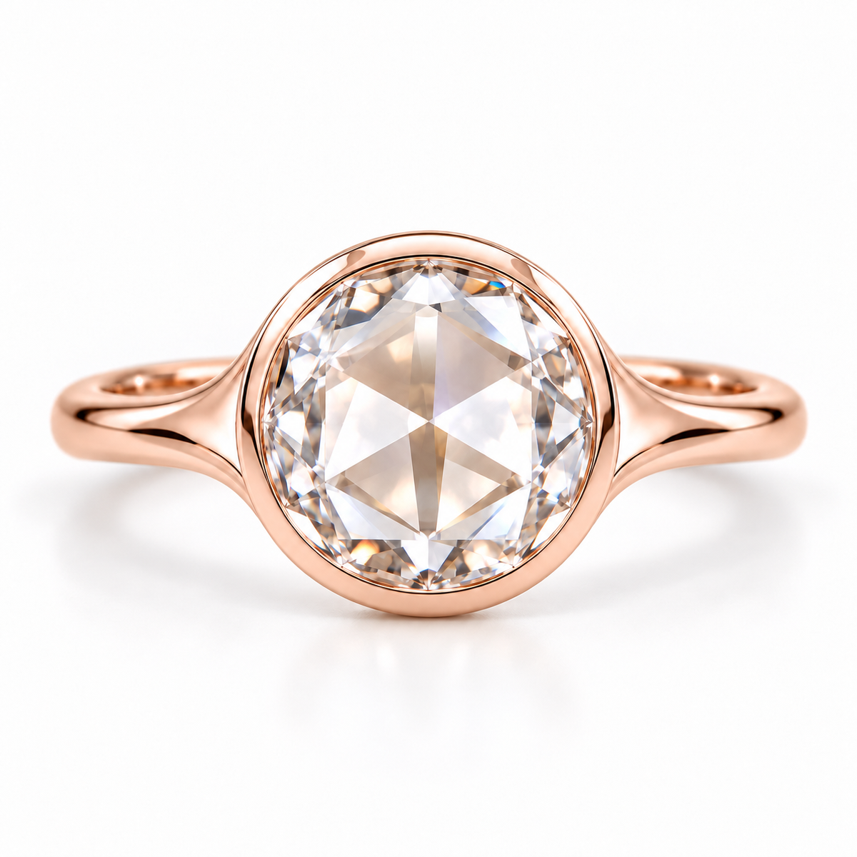 Round rose-cut lab-grown diamond solitaire ring with a smooth bezel setting and sculpted polished white-metal band