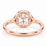 Round rose-cut lab-grown diamond solitaire ring with a smooth bezel setting and sculpted polished white-metal band
