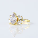 Seven Stone Pear Cut Moissanite Bezel Set Yellow Gold Ring