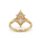 Marquise-cut lab-grown diamond engagement ring with round diamond side clusters and a slim yellow-gold band