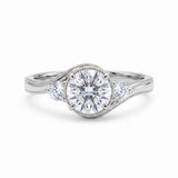 Round-cut lab-grown diamond three-stone bypass engagement ring with curved band