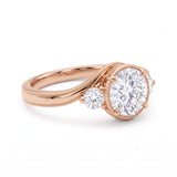 Round-cut lab-grown diamond three-stone bypass engagement ring with curved band
