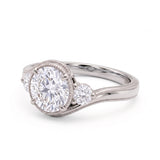 Round-cut lab-grown diamond three-stone bypass engagement ring with curved band