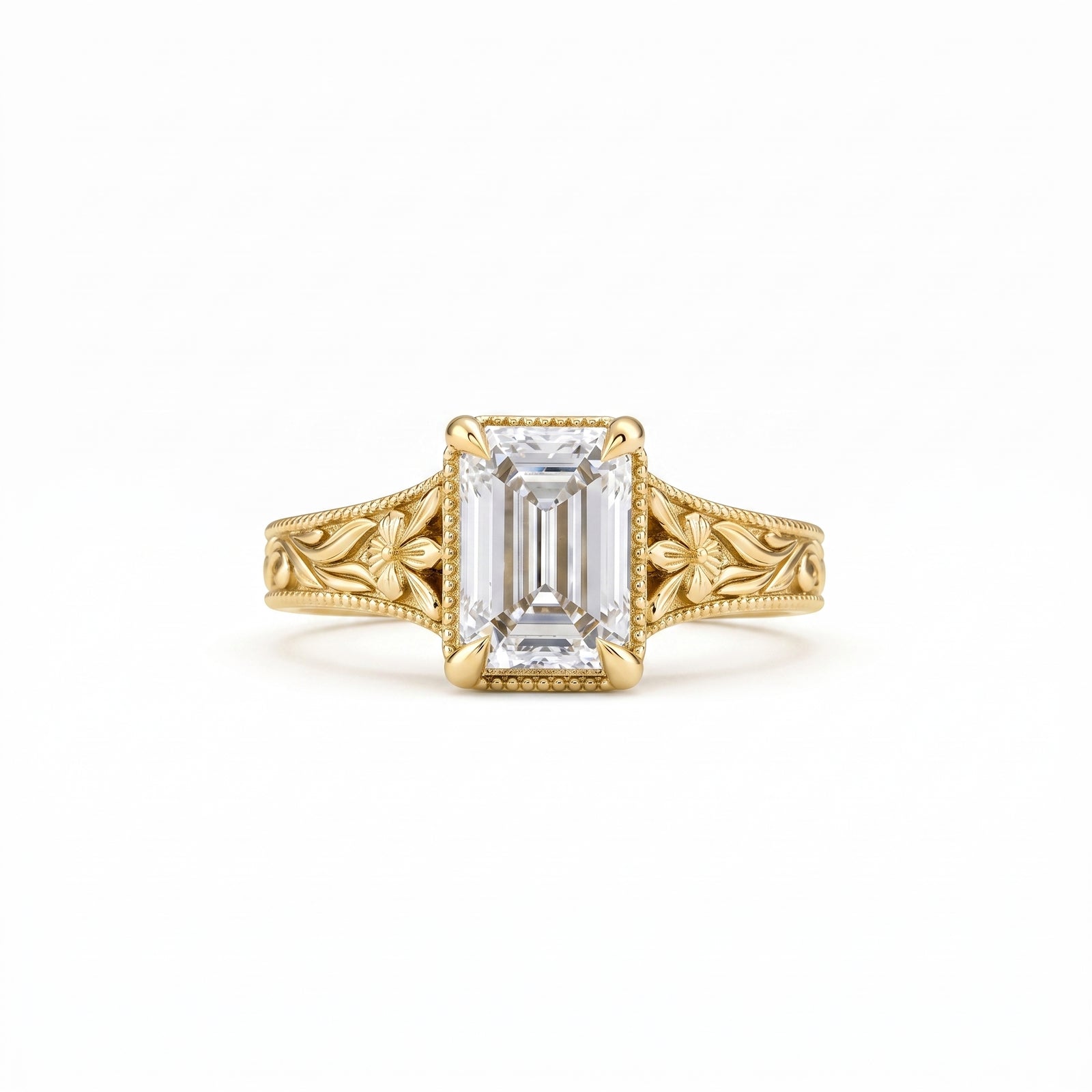 Vintage emerald-cut lab-grown diamond engagement ring with floral filigree, leaf engraving and milgrain detailing in polished yellow gold.