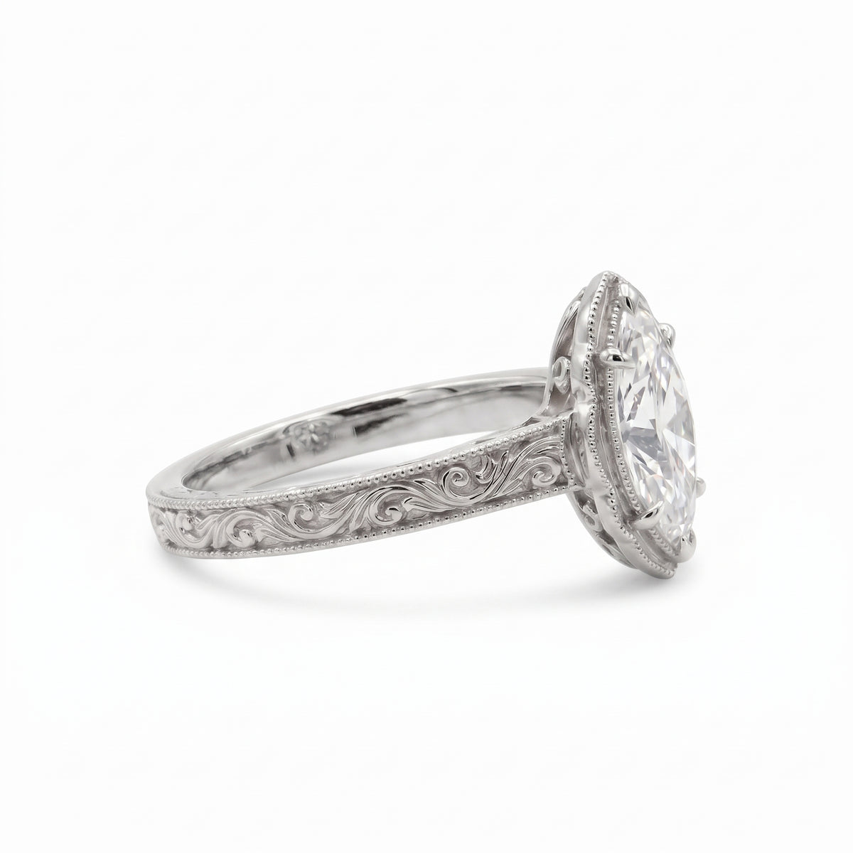 Vintage marquise-cut lab-grown diamond engagement ring with engraved band