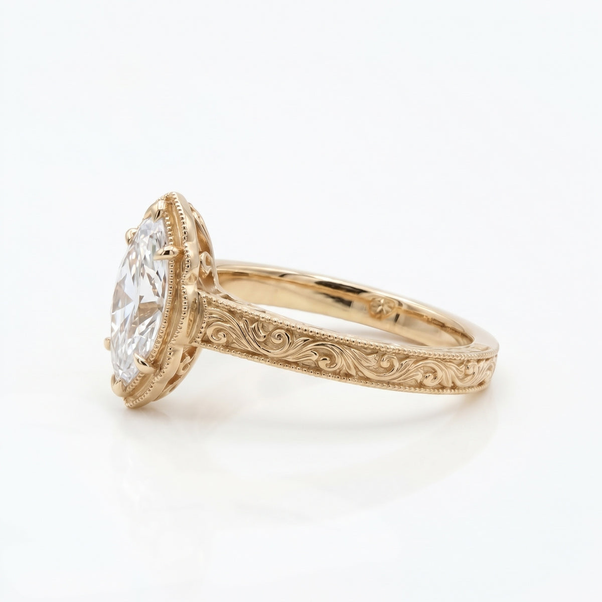 Vintage marquise-cut lab-grown diamond engagement ring with engraved band