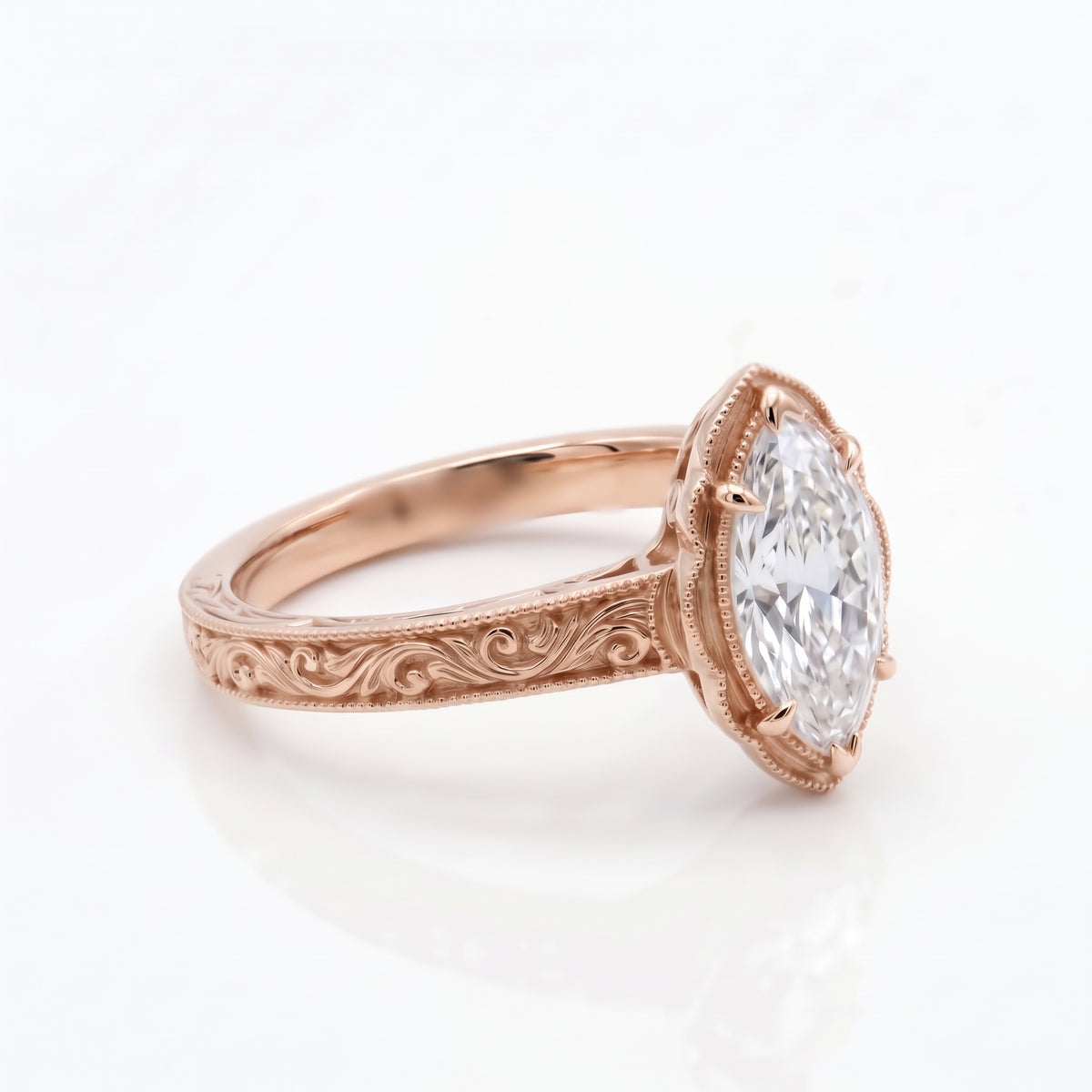 Vintage marquise-cut lab-grown diamond engagement ring with engraved band
