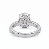 Oval-cut lab-grown diamond botanical engagement ring with leaf and vine band