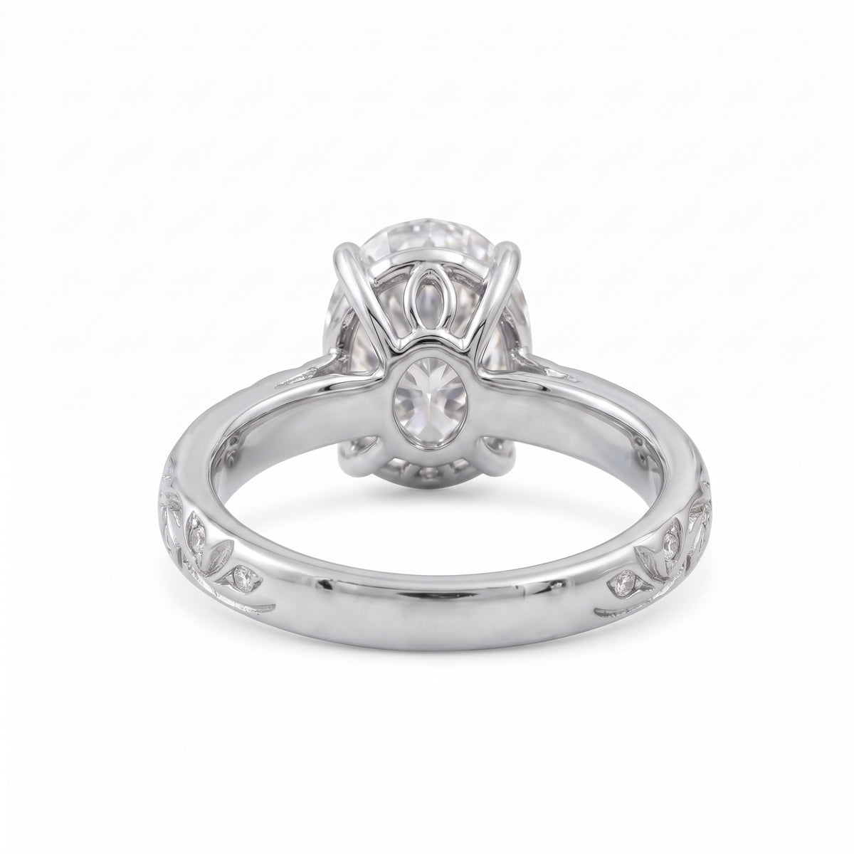 Oval-cut lab-grown diamond botanical engagement ring with leaf and vine band