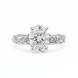 Oval-cut lab-grown diamond botanical engagement ring with leaf and vine band