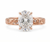 Oval-cut lab-grown diamond botanical engagement ring with leaf and vine band