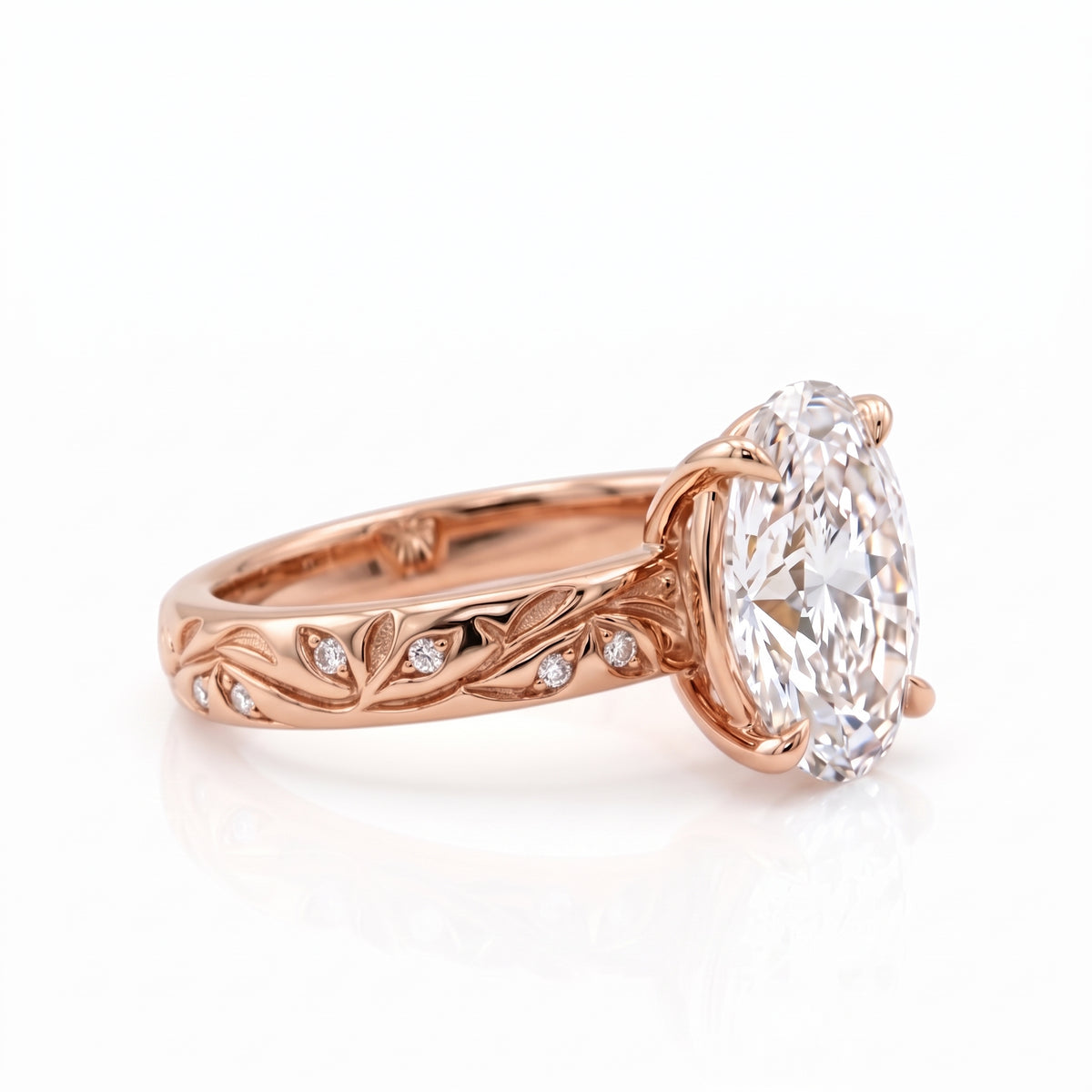 Oval-cut lab-grown diamond botanical engagement ring with leaf and vine band