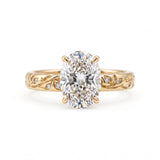 Oval-cut lab-grown diamond botanical engagement ring with leaf and vine band