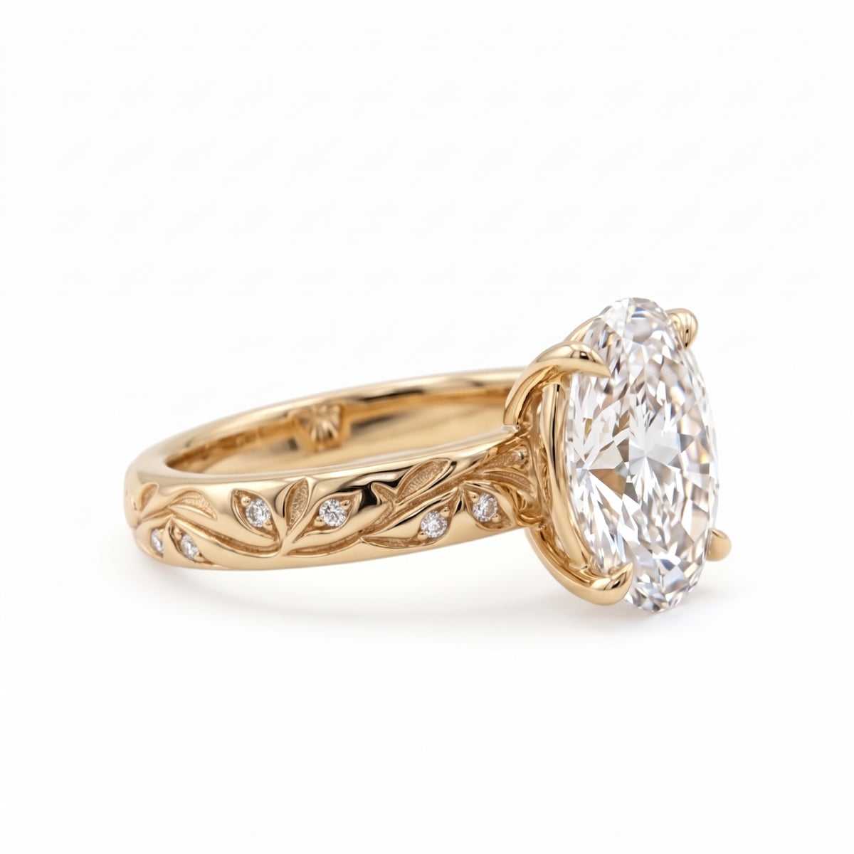 Oval-cut lab-grown diamond botanical engagement ring with leaf and vine band