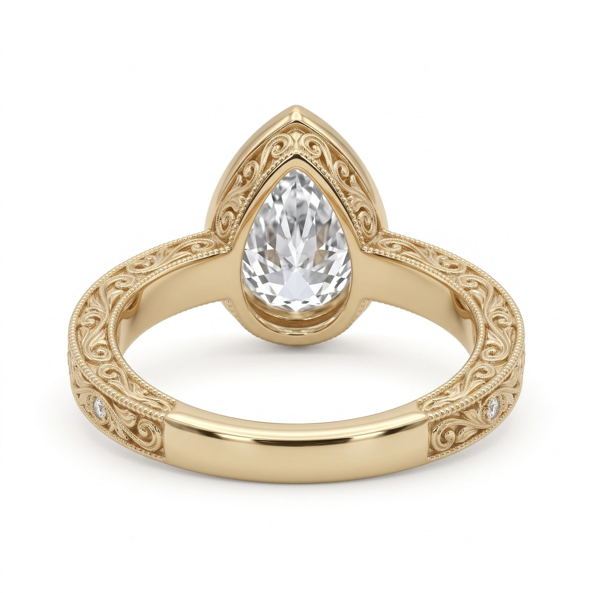 Vintage pear-cut lab-grown diamond bezel engagement ring with milgrain, scroll filigree and round diamond accents on a yellow-gold band.