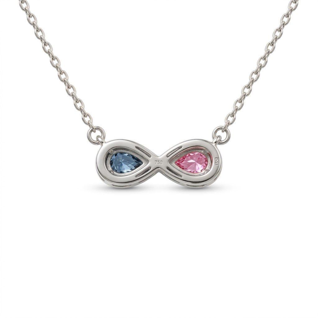 Discover a pink and blue pear-cut infinity pendant with smooth bezel settings. Personalize your gemstone pairing and metal with Gemlux Jewels.