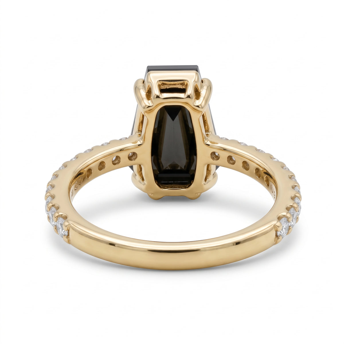 Black coffin-shaped gemstone engagement ring with four polished prongs and round clear accents along a white-metal band