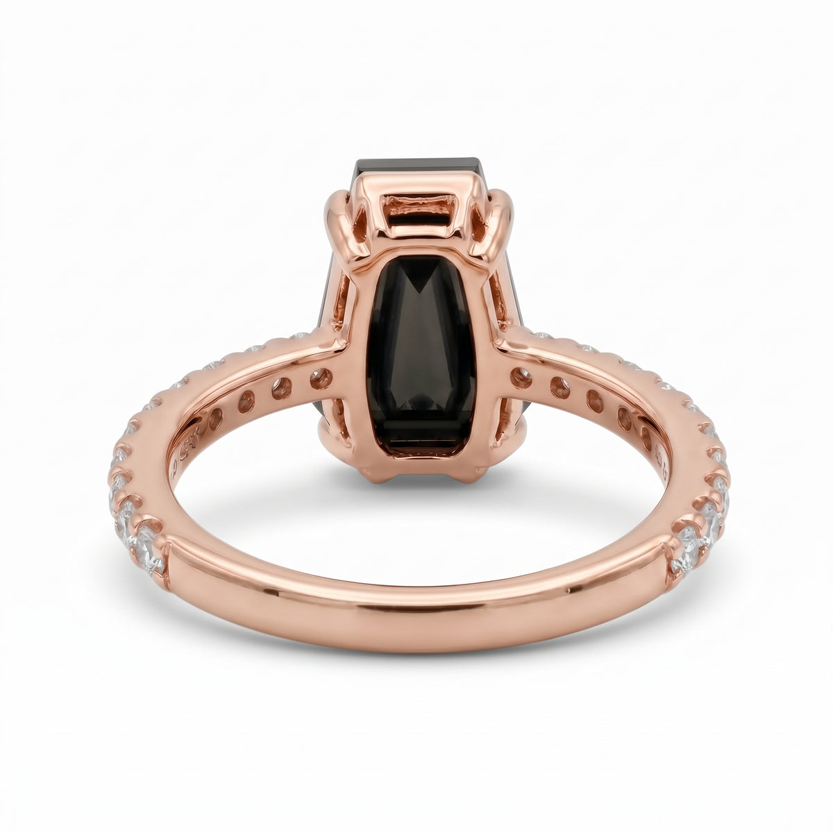 Black coffin-shaped gemstone engagement ring with four polished prongs and round clear accents along a white-metal band