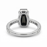 Black coffin-shaped gemstone engagement ring with four polished prongs and round clear accents along a white-metal band