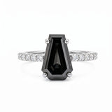 Black coffin-shaped gemstone engagement ring with four polished prongs and round clear accents along a white-metal band