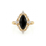 Black marquise gemstone ring with ornate white-metal scrollwork, clear round accent clusters and a polished band