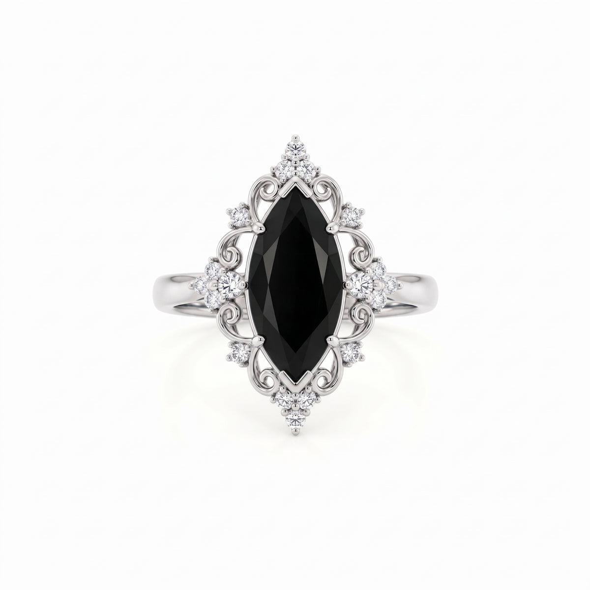 Black marquise gemstone ring with ornate white-metal scrollwork, clear round accent clusters and a polished band