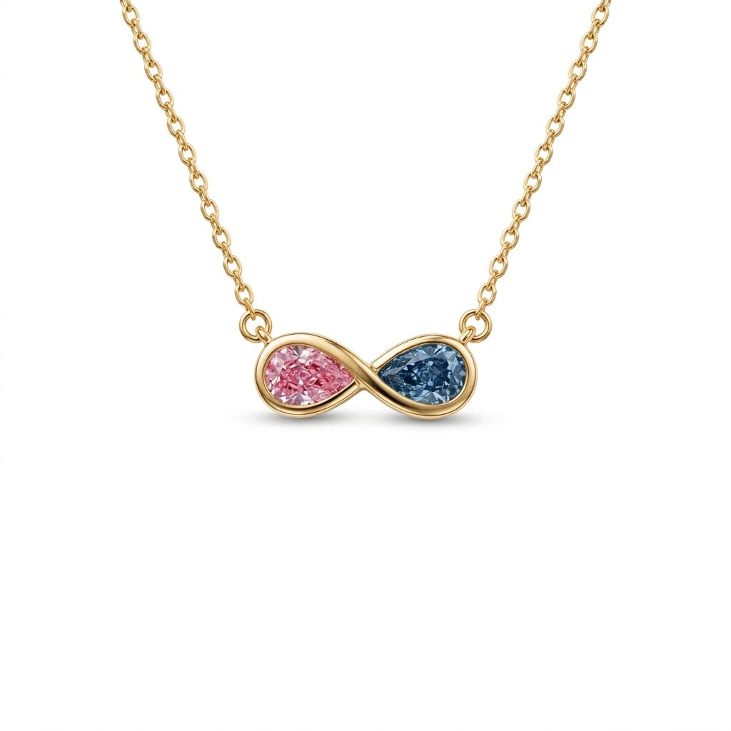 Discover a pink and blue pear-cut infinity pendant with smooth bezel settings. Personalize your gemstone pairing and metal with Gemlux Jewels.